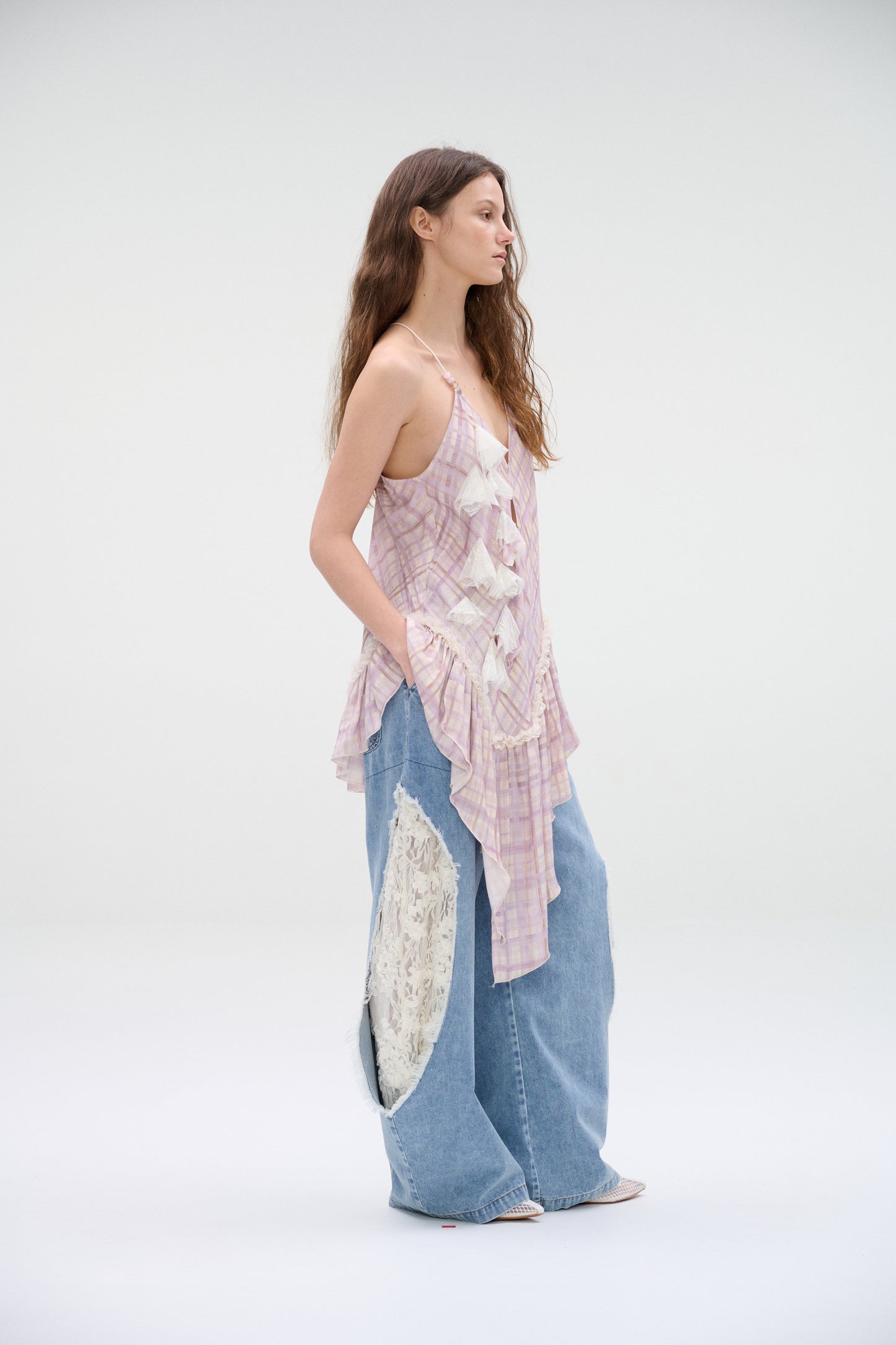 Wide-leg denim jeans with lace panel cutouts