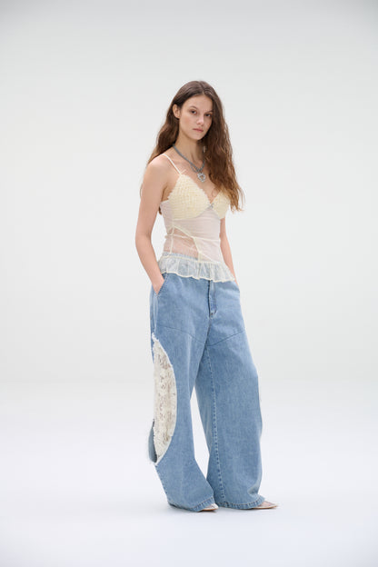Wide-leg denim jeans with lace panel cutouts